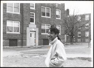 Young woman smiling in Newtowne Court