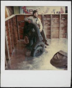 Man posing with tires