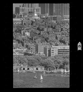 Sailboats on Charles River Basin with Beacon Hill in background, downtown Boston