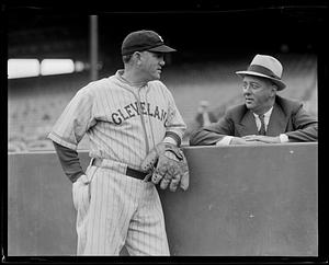 Cleveland Indians manager Steve O'Neill talking to an unidentified man in the stands at Fenway Park