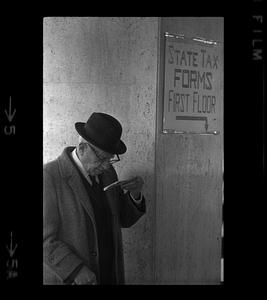 Old gentleman checks his tax form, Beacon Hill, Boston