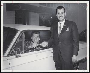 Boston Patriots star Gino Cappelletti is presented keys to 1967 Dodge Monaco 500, two-door hardtop for winning scoring title in American Football League with 121 points, Herbert A. Abramson, president of Silver Lake Dodge, Newton, representing Dodge Motor Division, awards gift, right.