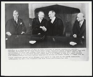 Peaceful But No Peace Treaty-- West German Chancellor Konrad Adenauer (second from left) and Secretary of State Dean Acheson shake hands at Bonn, Germany, conference table today as the representatives of the Big Three western powers meet in an attempt to wrap up a peace contract with Germany. Foreign Ministers Anthony Eden (left) of Britain and Robert Schuman of France look on. French conditions imposed before Schuman would agree to sign held up the treaty formalities.