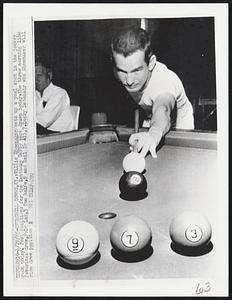 Willie Shoemaker sets up a pool shot in the Jockey room today. Post positions for the Kentucky Derby were drawn today. The three morning line favorites drew, Bold Lad, 3 Tom Rolfe, 9 and Hail to all, 7. Lucky Debonair who shoemaker will ride drew position 8.