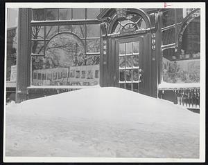 Stranded cars and huge drifts left in wake of worst Eastern U.S. storm in 16 years. It walloped Boston with 60-mile-an-hour winds. Huge drift formed at entrance to Boston Music Co. at 116 Boylston St.