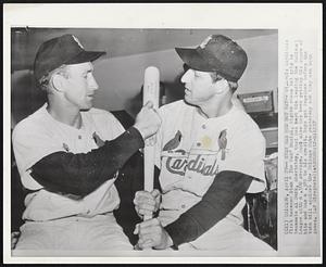 Stan Had Red Hot bat--St. Louis Cardinals first baseman Stan " The Man" Musial, right shows bat grip to teammate Al Dark, shortstop, that has kept him leading the National League with a.500 average. Dark also has been getting his share of hits and has a .385 to his credit. Boys got together before the twin bill against the Chicago Cubs yesterday and they won both games.