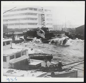 Typhoon Damage-Flimsy postwar homes were smashed flat, countless others uprooted and stores damaged as a typhoon swirled through Manila Dec. 26 to bring a disastrous halt to Christmas celebrations. Lower photo shows small craft which were piled on sea wall fronting Manila terminal building as winds of gale force swept the harbor.