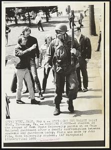 Kent, Ohio -- Copyright The Valley Daily News, Tarentum, Pa -- Accusing Finger -- A student on the campus of Kent State University points at an Ohio National guardsman after a deadly confrontation between students and guardsmen today. Photo was made by John Filo, Kent University student. Demonstrations.