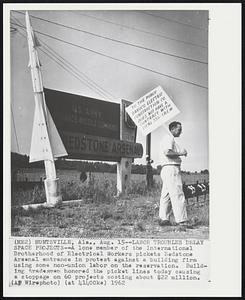 Huntsville, Ala. -- Labor Troubles Delay Space Projects -- A lone member of the International Brotherhood of Electric Workers pickets Redstone Arsenal entrance in protest against a building firm using some non-union labor on the reservation. Building tradesman honored the picket lines today causing a stoppage on 60 projects costing about $22 million.