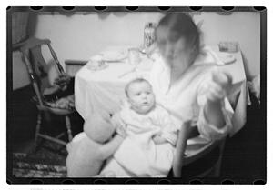 Maude Sanromá holding a baby on her lap