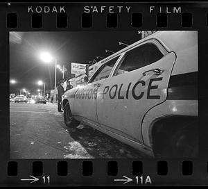 Police cruiser on the street at night, Mattapan