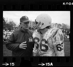 Coach and player at high school football game, Melrose, MA