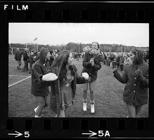 Cheerleaders at high school football game, Melrose, MA