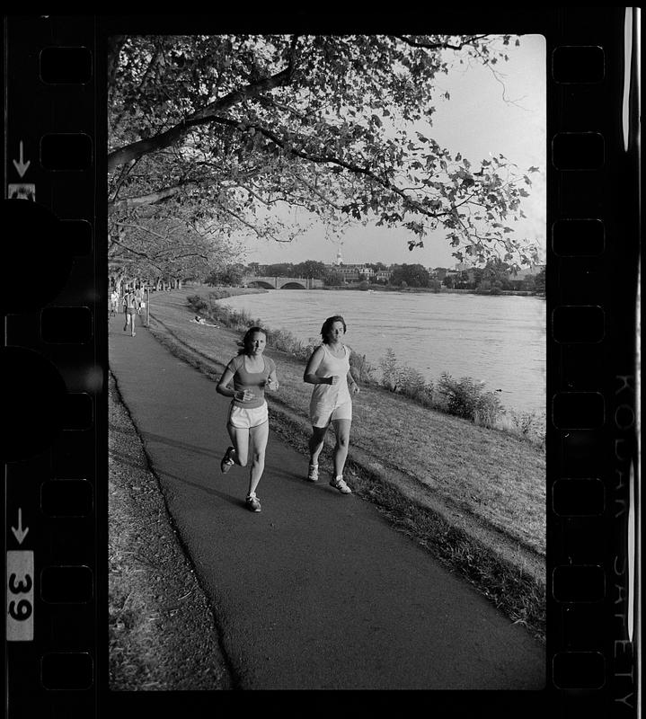 Jogging by the Charles River. Note Harvard Bridge in background, Cambridge