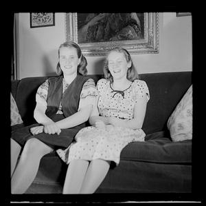 Two young women on sofa