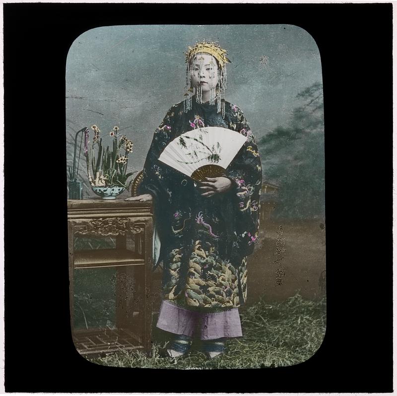 Geisha holding a fan