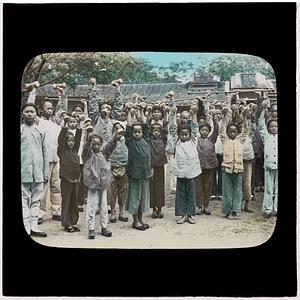 Group of people holding up weights