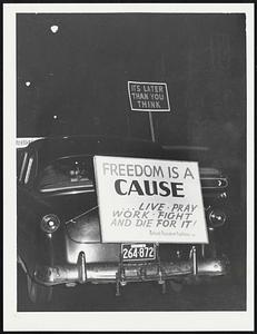 Sign on car following pickets in Harvard Square