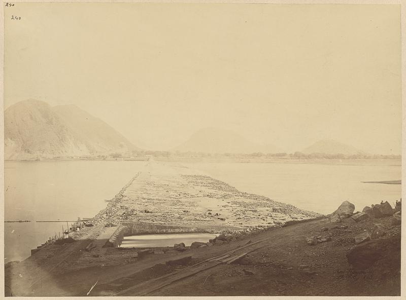 Kistnah Anicut from Seetanagram quarries, under sluices and tramway in foreground, Bezwada Town and hills in distance