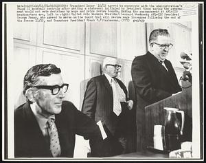 Organized labor 10/12 agreed to cooperate with the Administration's Phase 11 economic controls after getting a statement initialed by President Nixon saying the government would not veto decisions by wage and price review boards. Making the announcement at AFL-CIO headquarters are, left to right: United Auto Workers President Leonard Woodcock; AFL-CIO President George Meany, who agreed to serve on the board that will review wage increases following the end of the freeze 11/15, and Teamsters President Frank E. Fitzsimmons.