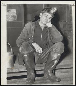 "Here We Go Again" -- Coal miner Joe Tyler, 71, who has worked in the mines since he was 15, sits dejectedly at the entrance of the Davidson mine at Gintown, near Birmingham, Ala. He reported for work, but Gintown miners decided to join others over the country in striking, so, like it or not, Joe strikes too.