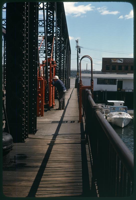 A man looking through bridge