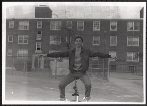 Young man balancing on a bike