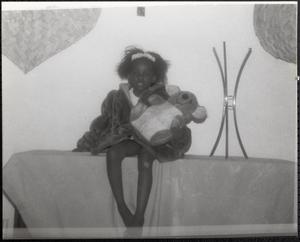 Girl holding a teddy bear
