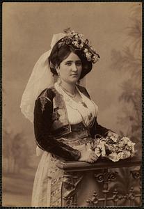 Studio portrait of woman in traditional Greek dress