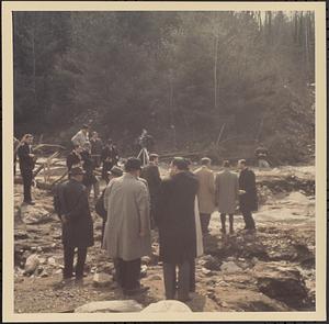 Men looking at flood damage