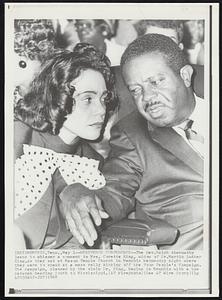 Whispered Conference - The Rev. Ralph Abernathy leans to whisper a comment to Mrs. Coretta King, widow of Dr. Martin Luther King, as they sat at Mason Temple Church in Memphis Wednesday night where they were to speak at a mass rally kicking off the Poor People's Campaign. The campaign, planned by the slain Dr. King, begins in Memphis with a bus caravan heading South to Mississippi.