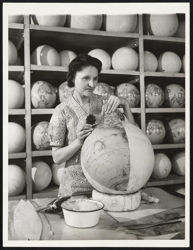 The Map Maker in A Changing World Chicago - It takes a full year for a girl to become proficient in mounting globes by hand. "Pat" Matalonis has been at it for 18 years. She soaks each of the 12 cut-out paper gores with paste. She then places them one at a time on the ball, rubbing each so as to stretch fully. The Trick is to get the first 11 gores so accurately placed that the 12th will exactly fit.