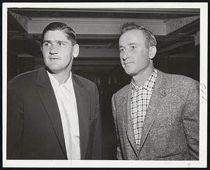 Pair of Hurlers, Alex Kellner (left) and Bill Harrington, mark time in Hotel Kenmore lobby thinking of what they hope A's will do to the Red Sox starting this afternoon as Western club opens first invasion of the East.