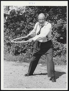 Don Carr, manager, F.W. Woolworth, Wollaston Branch, President Wollaston Businessmens’ Association, with hula hoop
