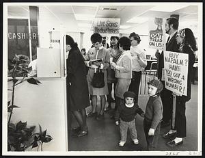 Newtonville housewives pay store bills less taxes to protest war in Vietnam.