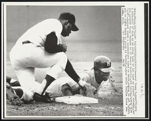 Red Sox-Brewers-Boston- Brewers' Tommy Harper (R) gets a face-full of dirt as he dives back to 1st base on pickoff attempt, Bosox pitcher Sonny Seibert to 1B George Scott (L), 3rd inning, Fenway Park (4/28). Seibert threw 4 consecutive times to Scott, trying to get Harper, and on fifth throw to plate by Seibert, Harper stole 2nd. The Bosox won game, 10-3.
