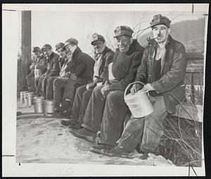 Lewis, Not Uncle Sam, Their Hero -- Among 36,000 soft coal miners who "jumped gun" on tomorrow midnight strike deadline and quit work yesterday were these workers at the Black Diamond mine in Monongahela, Pa. Striking miners ignored U.S. plea to honor contract, but otherwise observed a worried silence on what they thought of the coal crisis.