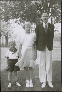 Three siblings: Alan is youngest, Marjorie, and Neal in tie