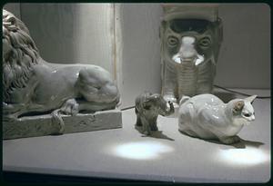 Figurines of a lion, a cat and two elephants