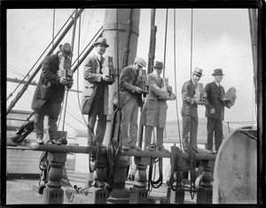 News photographers - with Graflex cameras on boat rail, Boston