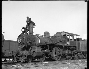 LJ [Leslie Jones] climbs atop old steam locomotive no. 1688 to get his shot