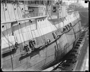 USS Utah in South Boston drydock - showing dents in blisters - damage caused while going through Panama Canal during President Hoover's goodwill trip to South America.