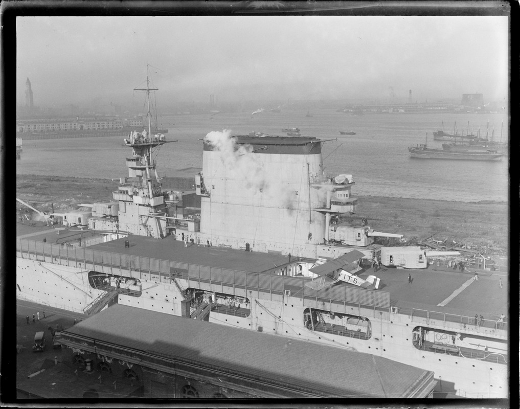 USS Lexington in dry dock with 1st plane on deck