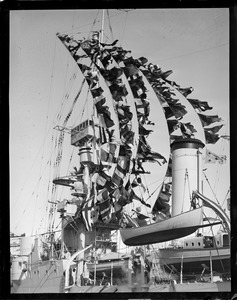 USS Milwaukee in Navy Yard with pennants flying