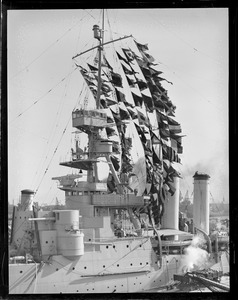 USS Milwaukee in Navy Yard with pennants flying