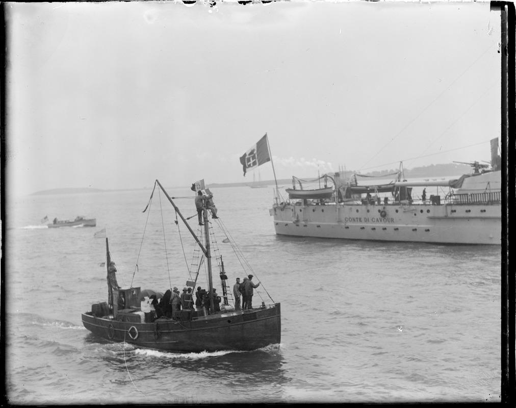 Italian fisherman turn out in full force to see their fellow countrymen when they arrive on the battleship Conte Di Cavour