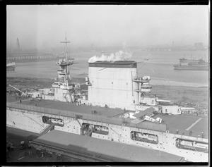 USS Lexington in drydock with first plane on deck