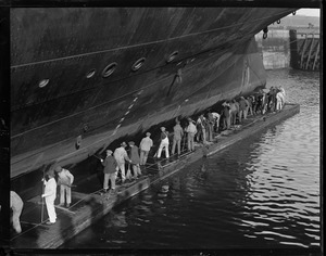 Crew cleaning hull of the Majestic