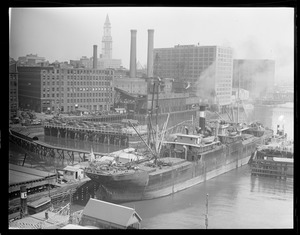 SS Evelyn , bull line sugar boat, being towed through Summer and Congress St. bridges, Fort Point Channel