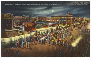Boardwalk, looking north from auditorium, at night, Wildwood, N. J.